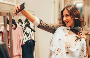 Person shopping taking selfie